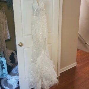 Porschia & Scarlette off-white sequin, slitted gown with feather train